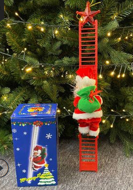 KlĂ€ttrande tomte - Juldekoration pĂ„ stege eller snöređ